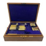 Early 20th century oak canteen of silver-plated cutlery with brass presentation plaque dated 1910