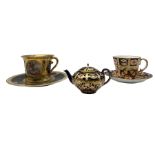 Vienna style cabinet cup and saucer decorated with panels of classical scenes with floral gilt detai