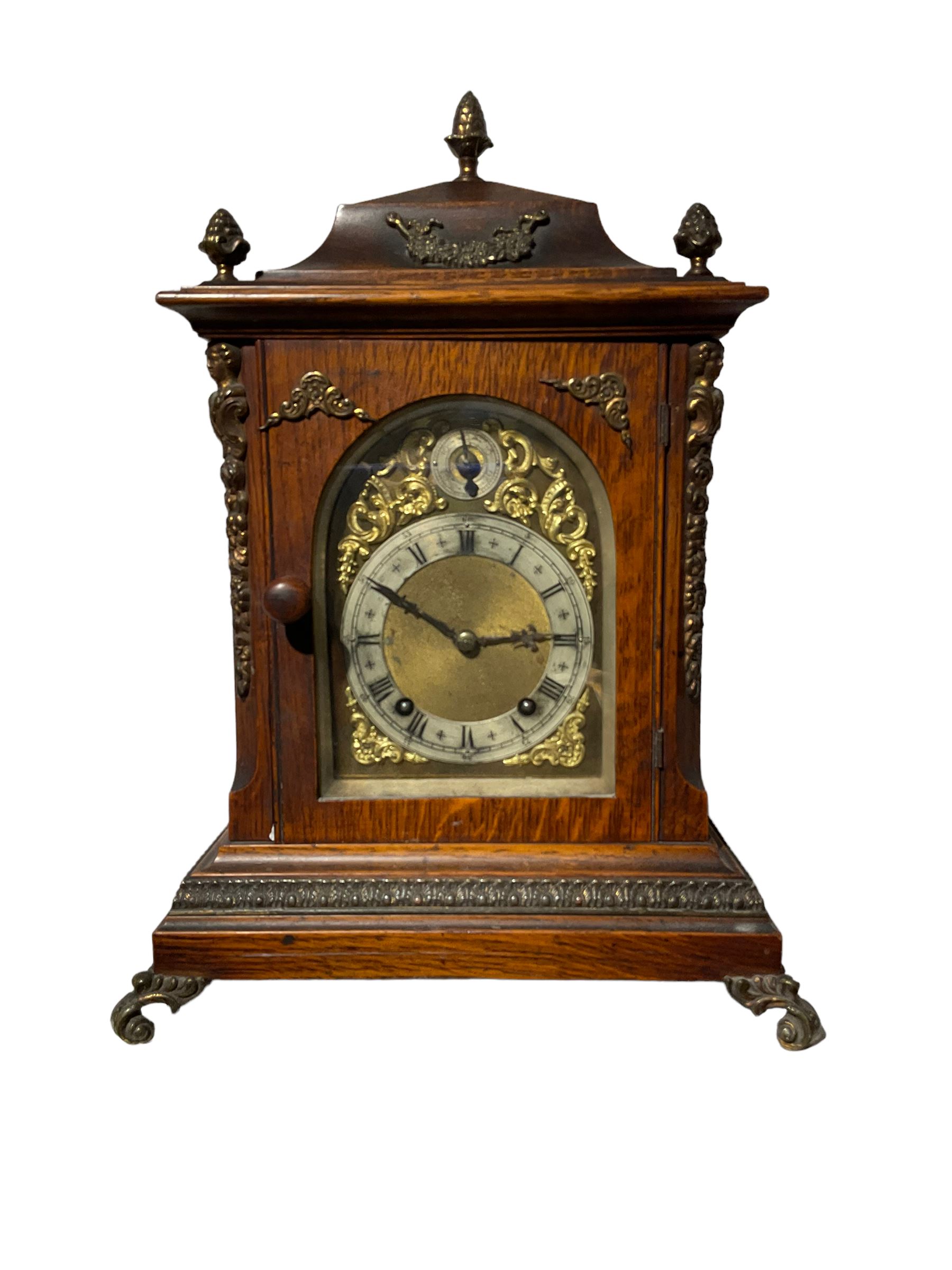 Winterhalder & Hoffmeier - 8-day quarter-striking German mantle clock in an oak case c1900