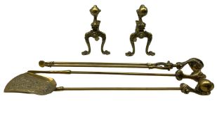 Pair of brass fire dogs modelled as talons with ornate decoration and feet together with matching fi