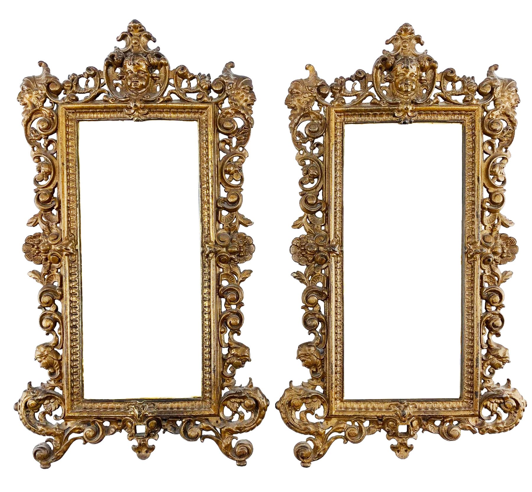 Pair of Victorian patinated cast iron wall mirrors