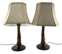 Pair of table lamps formed from deer slots mounted on oak shields