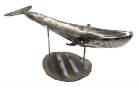 Modern silver model of a Blue Whale on agate slice stand