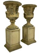 Pair of composite stone classical design urns