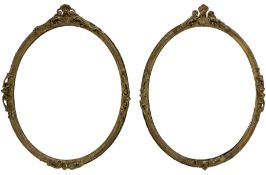 Near pair of 19th century giltwood and gesso framed oval wall mirrors