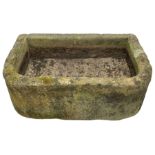 Large weathered sandstone D-shaped trough