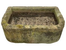 Large weathered sandstone D-shaped trough
