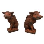 Pair of terracotta finish composite stone garden figures in the form of wild boars