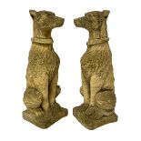 Pair of composite stone garden ornaments in the form of seated lurchers