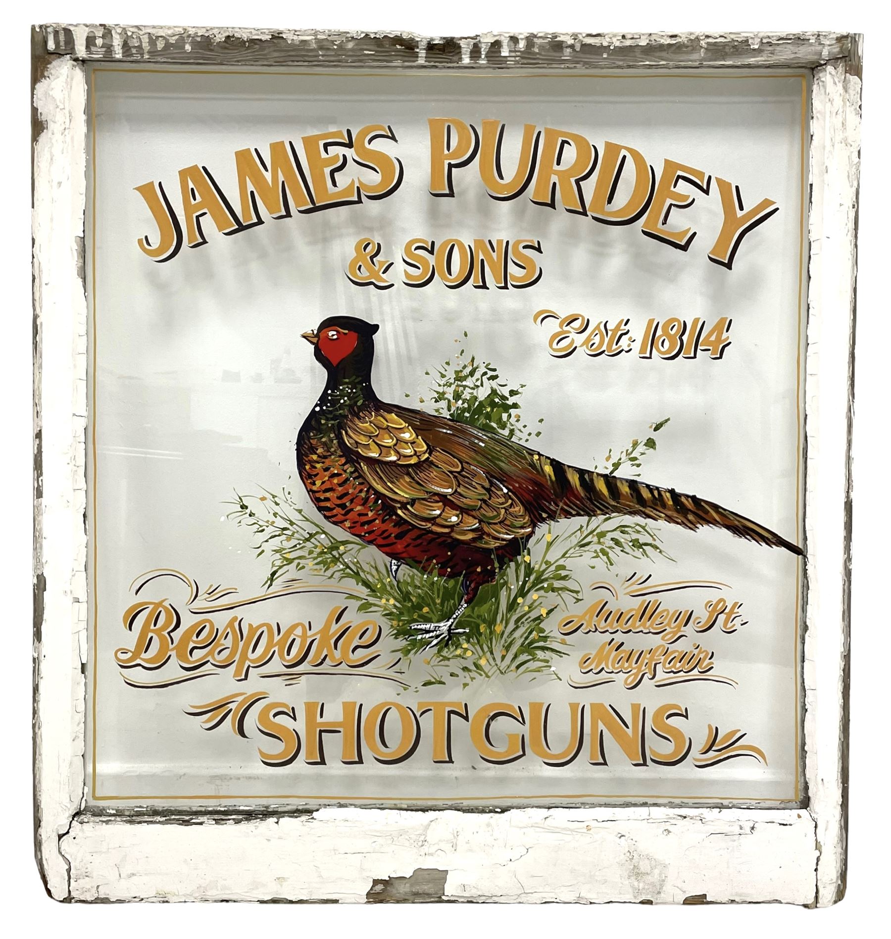 White painted window with hand painted advertising "Purdey and Sons