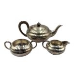 Silver three piece tea set of compressed circular design