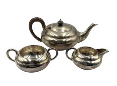 Silver three piece tea set of compressed circular design