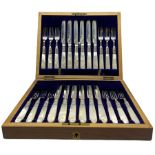 Set of 12 late Victorian silver bladed dessert knives and forks with engraved decoration and mother