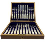 Set of 12 late Victorian silver bladed dessert knives and forks with engraved decoration and mother