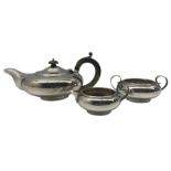 Silver teapot of compressed circular form with stained handle and lift Sheffield 1930 and matching m