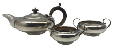 Silver teapot of compressed circular form with stained handle and lift Sheffield 1930 and matching m