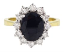 18ct gold oval sapphire and round brilliant cut diamond cluster ring