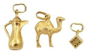 Three 18ct gold pendant/charms including jug camel and dice