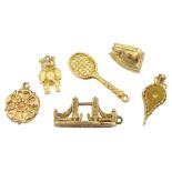 Six 9ct gold pendant/charms including Tower Bridge London