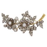 Early 20th century gold and silver white sapphire and paste stone set flower spray brooch