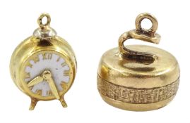 14ct gold clock charm and a 9ct gold curling stone charm