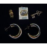 Pair of gold hoop earrings and three gold pendant/charms including owl