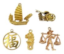 Two 14ct gold charms including rickshaw and lion and three 9ct gold charms including Chinese farmer