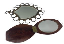 Art Nouveau shield shaped wall mirror with scrolled and floral edging together with hinged travel mi