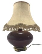 Ceramic lamp on metal foot in burgundy glaze together with tassle shade