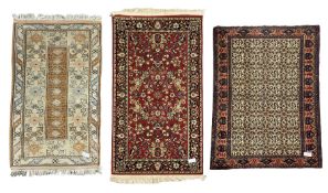 Persian ivory ground rug decorated with floral Boteh motifs (148cm x 130cm)