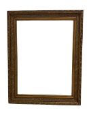 Large wall mirror in heavy swept gilt frame with floral swags