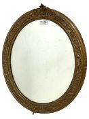 Gilt framed oval wall mirror with foliate design and beading 54cm x 46cm