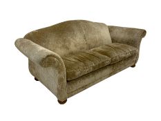 Large two seat sofa upholstered in champagne fabric