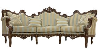 Italian Rococo style carved walnut finish curved three seat wingback sofa