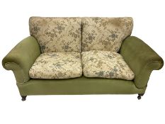 Early 20th century two seat drop arm sofa upholstered in green and floral fabric