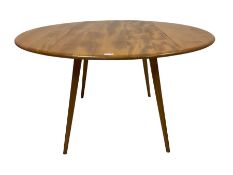 Ercol - mid-20th century elm and beech 'Round Shaped Dining Table'