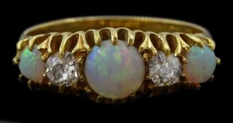 Early 20th century five stone opal and old cut diamond ring