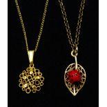 Gold ladybird on a leaf pendant necklace and a gold circular pendant necklace