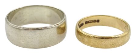 White gold wedding band and a yellow gold wedding band