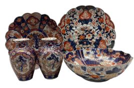 Pair of Japanese Meiji ovoid form vases decorated in the Imari pallet