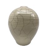 Rudie Delanghe (British 1955-): Studio pottery raku vase of ovoid form with partial crackle glaze