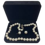 Cultured pearl necklace and matching earrings