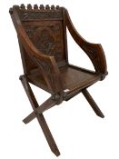 Late 19th century gothic revival oak Glastonbury chair