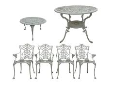 Cast aluminium white painted circular garden table with pierced foliate and scroll decoration; set f