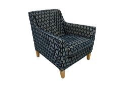 DFS - deep armchair upholstered in blue and white geometric patterned fabric