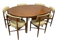 Victor B Wilkins for G-Plan - mid-20th century circular teak extending dining table; and set six mat