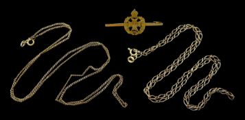 Two gold necklaces and a gold military brooch