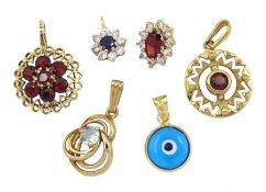 Five 9ct gold stone set pendants including sapphire and garnet and a 14ct gold glass pendant