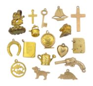Fifteen 9ct gold charms including watering can