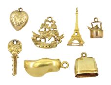 Gold pendant/charms including two 18ct Eiffel tower and clog